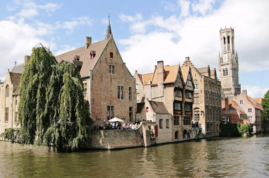 tower, canal, channel, belfry, bruges, nature, historically, places of interest, historic center, idyllic, facades, architecture, medieval city, water, city, river, picturesque, belgium, structures, waterways, construction art, culture, beautiful, city view, romance, tourism, old, old town, masonry, sky, old buildings, bridge, stone bridge, summer, trees, building, antique, ancient building, middle ages, stone wall, world heritage, unesco, unesco world heritage, cultural monument