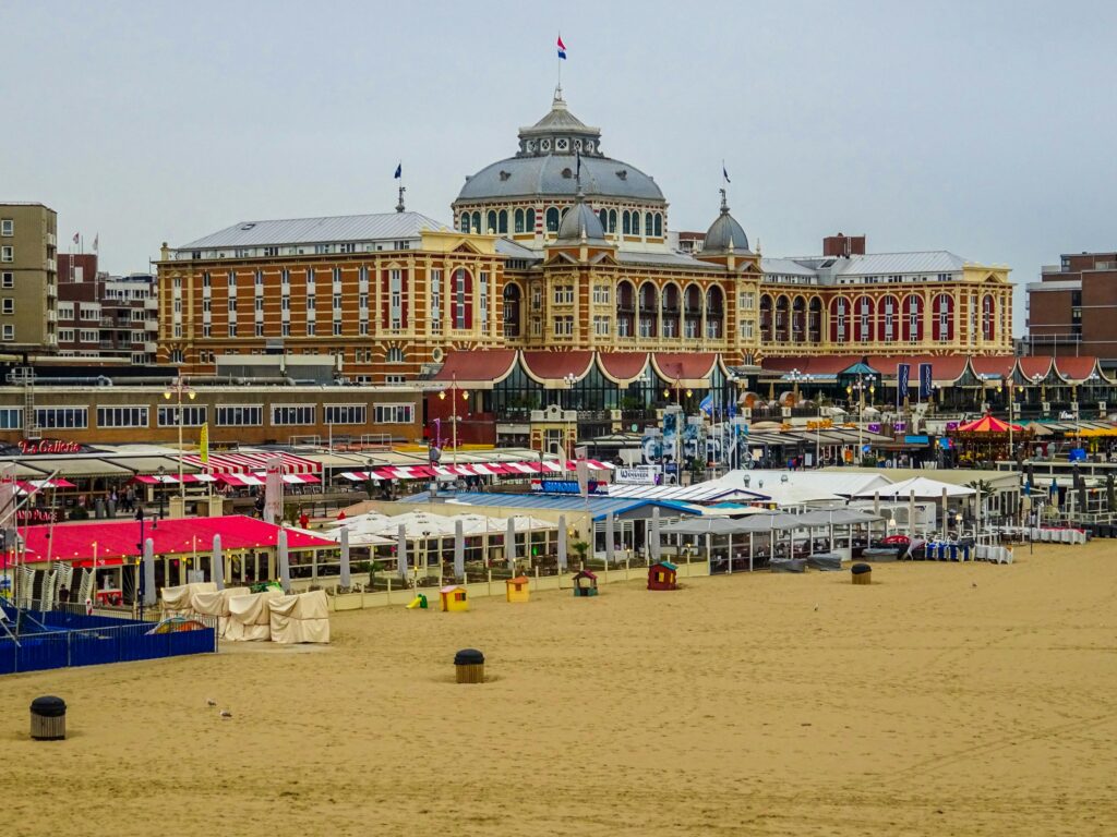 Scenic view of the historic Grand Hotel Kurhaus nestled on the beachfront in Scheveningen, Netherlands.