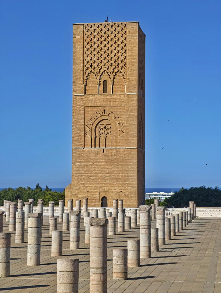 Explore the architectural beauty of Hassan Tower in Rabat, Morocco, on a sunny day.